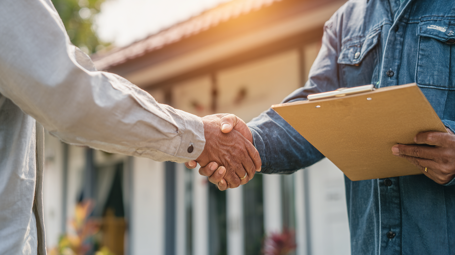 Contractor shaking hands with homeowner during remodeling consultation